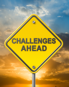 "Challenges ahead" road sign.